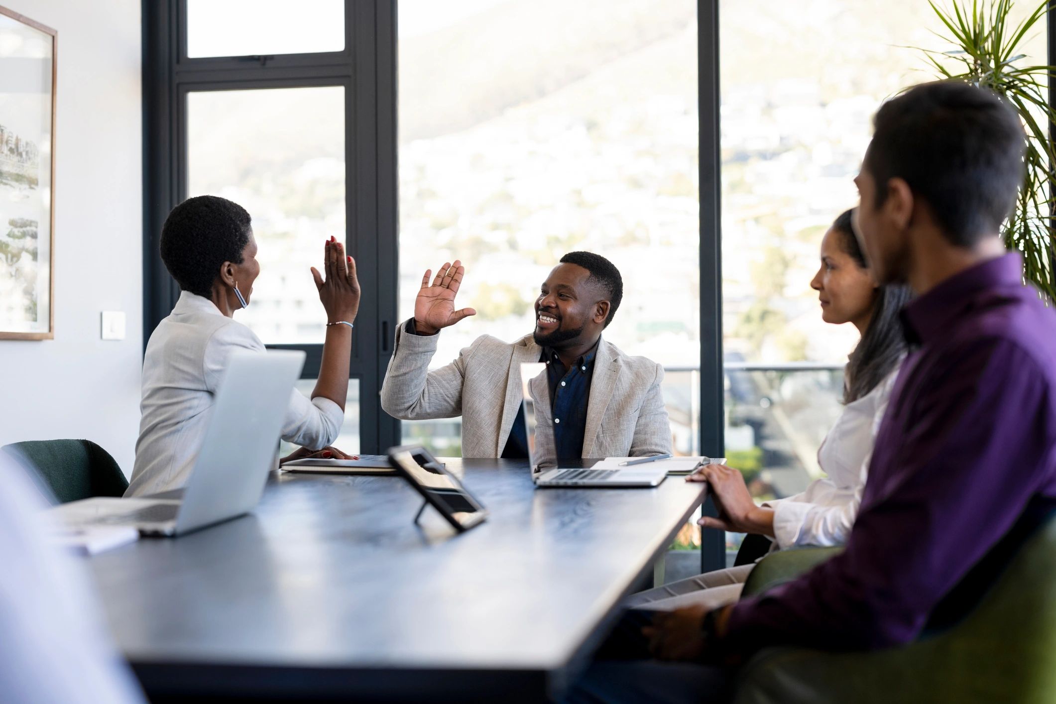 Business professionals celebrating a successful meeting