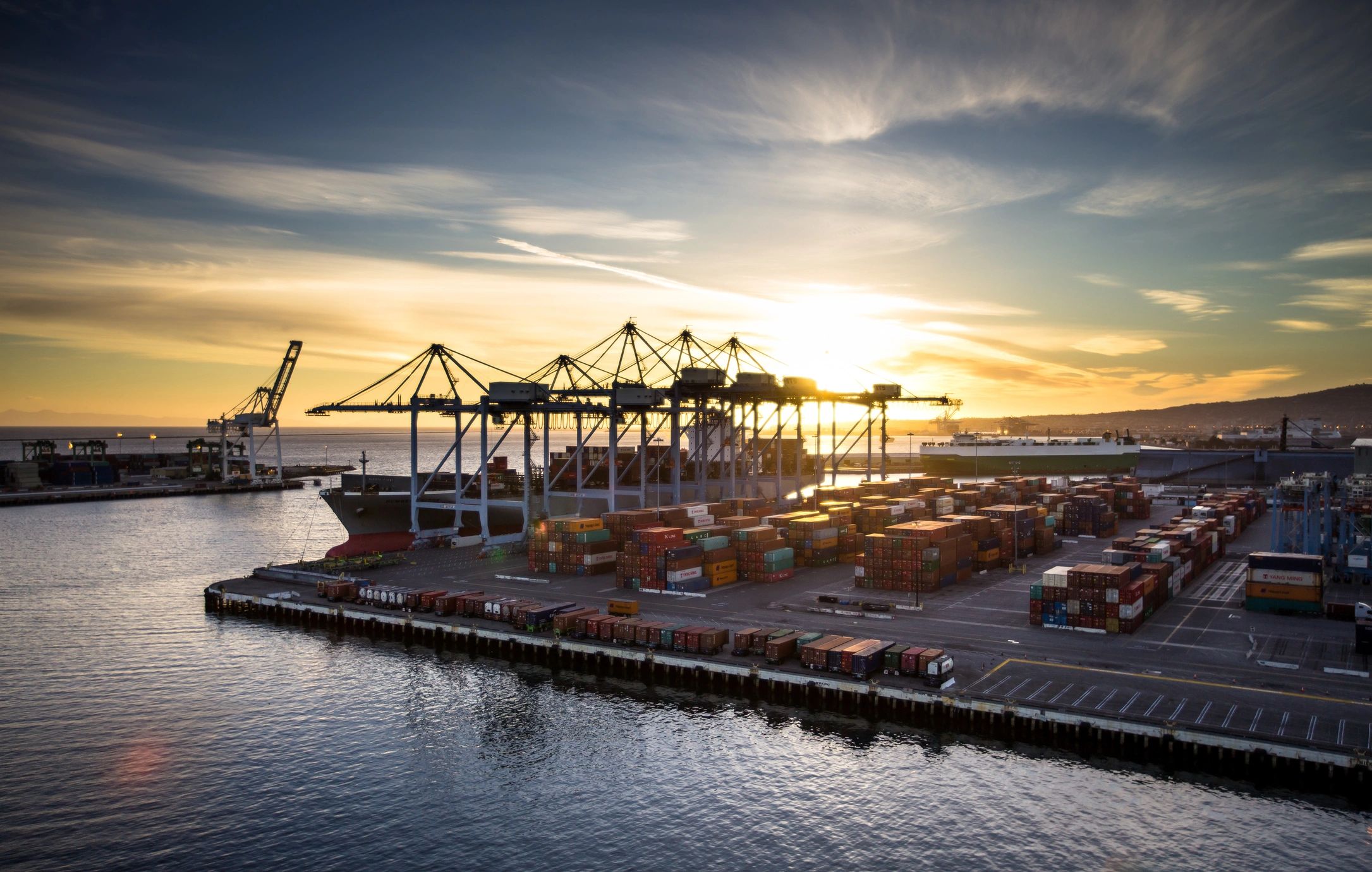 Shipping containers at a busy cargo port